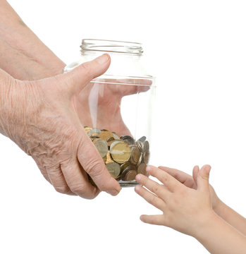 elderly person transfers to bank to hands of the child