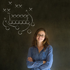Woman with American football strategy on blackboard