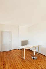 home interior, view table in a room with white walls