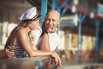 Fototapeta na wymiar Couple in love on dating near sea at honeymoon