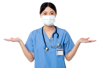 Female physician posing with open palms