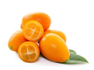 kumquat with leaf close up on white background