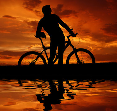 silhouette cyclist in the sunset
