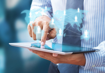 businessman using tablet and social network as concept
