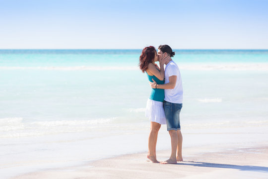 Young Couple Embraced in a Caribbean Beach