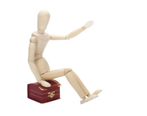 Wooden dummy  with gift box,  isolated on a white background