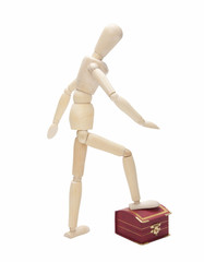 Wooden dummy  with gift box,  isolated on a white background