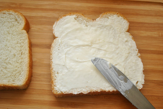 Speading Mayo On White Bread