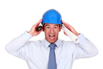 businessman with a helmet having a headache