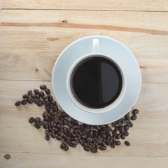 Cup of coffee with coffee beans