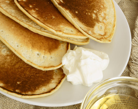 Pancakes with sour cream and syrup