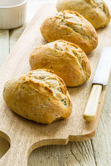 Bread rolls on a board