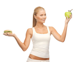 woman with apple and hamburger