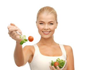 healthy woman holding bowl with salad