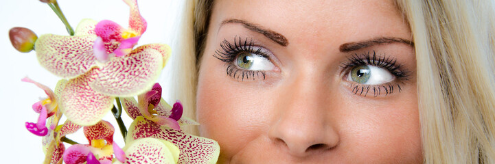 Obraz premium schöne augen mit orchidee