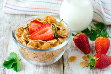 Corn flakes with strawberries , Breakfast .