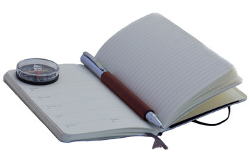 Open diary with a pen with compass, isolated over white