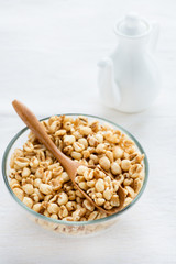 Bowl of puffed wheat cereal for breakfast
