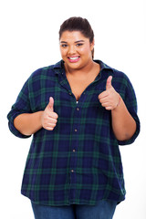 cheerful young woman giving thumbs up