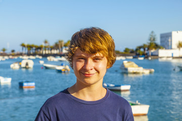 Fototapeta premium handsome happy smiling boy with the famous charco de San Gines i