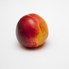 Peach nectarine family fruit on white background