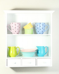 Kitchen utensils on beautiful white shelves