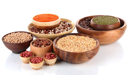Different kinds of beans in bowls isolated on white