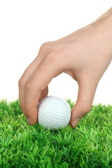 Golf ball in hand isolated on white
