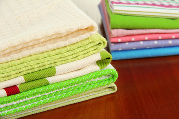 Kitchen towels, on wooden background