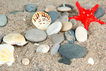 Sea stones on sand background
