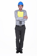 Man with helmet holding report