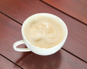 Cup of cappuccino on table