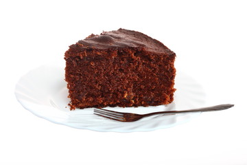 Piece of chocolate cake on white plate