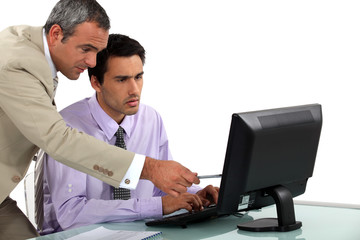 Fototapeta premium Man pointing out an error to his colleague