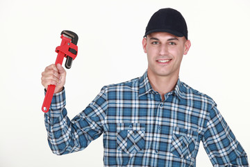 Man with an adjustable wrench
