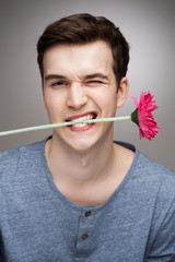 Man with flower in his mouth