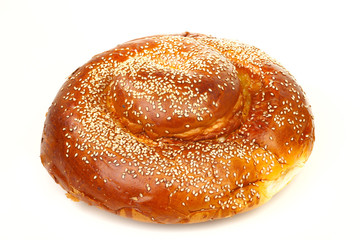 Many white seeds on a round sabbath challah