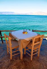 greek outdoor restaurant with Mediterranean sea view(Crete, Gree