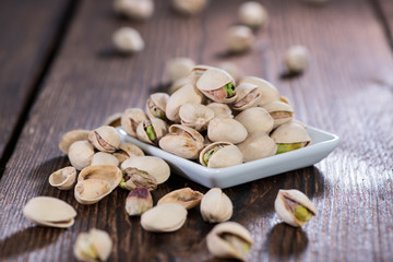 Pistachios on wooden background