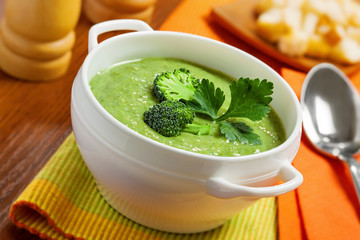 Broccoli cream soup on table