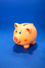 Piggy bank on blue
