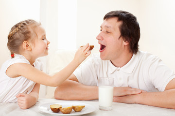 Obraz na płótnie Canvas Child with father have a breakfast