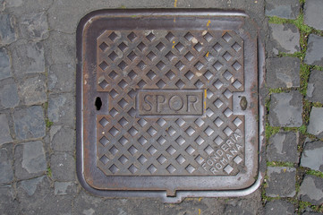 Naklejka premium SPQR, typical manhole cover in Rome, Italy