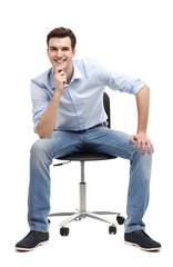 Young man sitting in chair
