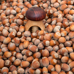 Wooden nutcracker on a pile of nuts
