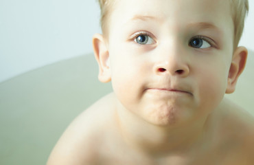 Funny little boy in bathroom