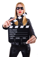 Woman with movie clapper on white