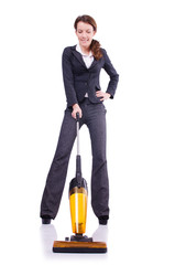 Young woman with vacuum cleaner on white