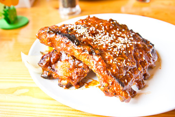 grilled pork ribs steak on white plate