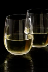Canvas schilderij Wijn stemless white wine glasses  © wollertz